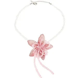 Sweet pink beaded necklace featuring a large mesh flower pendant with crystal tassels