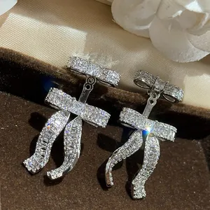 Elegant silver-plated double bow earrings encrusted with sparkling cubic zirconia stones