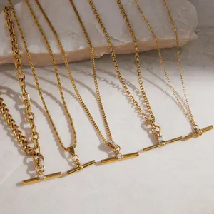 Macro view of gold-plated titanium steel T-bar necklaces featuring diverse chain designs