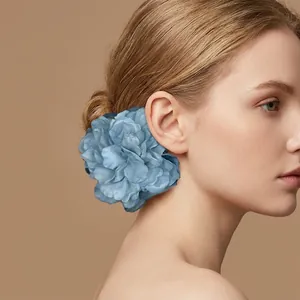 Large blue fabric flower hair clip for elegant bun hairstyle accessory for women