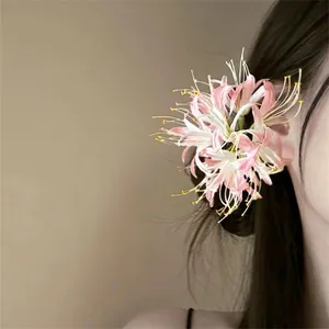 Elegant pink and white layered fabric flower hair clip accessory for elegant updo hair styles