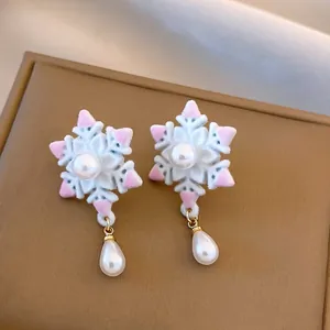 French vintage style snowflake stud earrings with elegant white pearl drop tassels