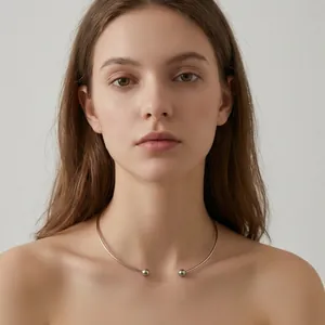 Minimalist silver C-shaped titanium steel choker necklace worn by a model