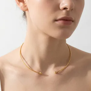 Elegant minimalist gold titanium steel C-shape choker necklace worn by female model
