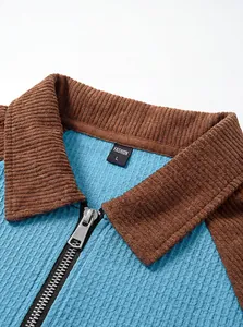 Close-up detail of men's waffle knit half-zip polo shirt featuring a brown corduroy collar