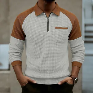 Stylish men's waffle knit half-zip polo shirt in grey and brown color blocking design