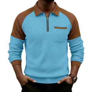 Men's waffle knit half-zip polo shirt with light blue and brown color blocking design
