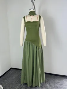 Olive green sleeveless maxi dress featuring an asymmetrical waist shown on a mannequin.