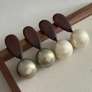 Vintage handcrafted brown wood and large round pearl drop earrings in minimalist style