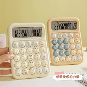 Close-up of portable mechanical calculators with cute smiley faces and dopamine colors