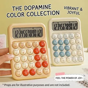 Détail de calculatrices mécaniques portables avec smileys mignons et couleurs dopamine