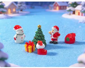 Macro view of Christmas resin miniature set featuring Santa Claus, Snowman and tree