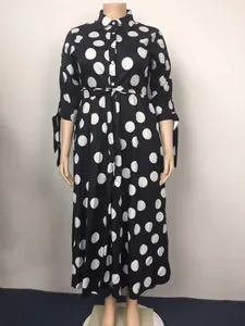 Elegant plus size black and white polka dot maxi shirt dress with stylish tie cuffs detail