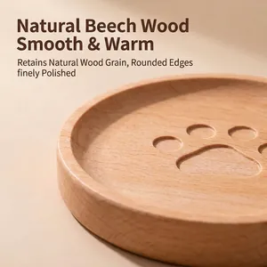 Close-up of a Japanese beech wood coaster with a cute bear paw print design.