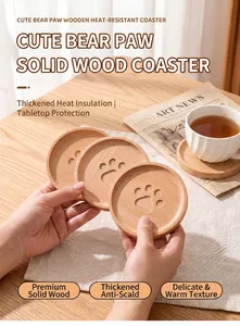 Detailed macro view of cute bear paw engraved wooden coasters made from solid beech wood