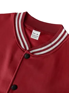 Close-up view of red varsity jacket collar showing white stripes and material label