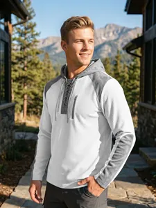 Detailed view of men's waffle knit hoodie featuring lace-up front and grey contrast sleeves