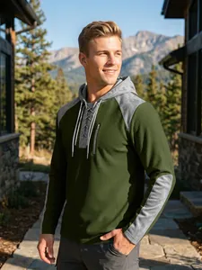 Detail view of men's waffle knit hoodie with lace-up neck and contrast sleeves