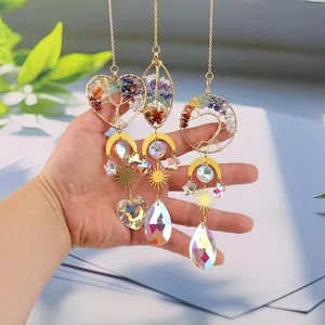 Set of golden tree of life heart suncatchers with colorful stones and crystal prisms