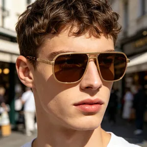 Male model wearing gold metal square sunglasses with hollow bridge design