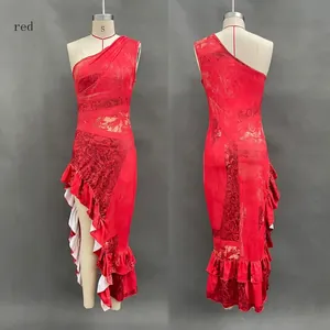 Detail view of vintage red floral print asymmetrical maxi dress with high ruffle slit.