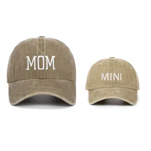 Matching MOM and MINI embroidered washed cotton baseball caps for parent and child.