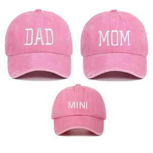 Detail view of embroidered pink cotton baseball cap set for Mom Dad and Mini.