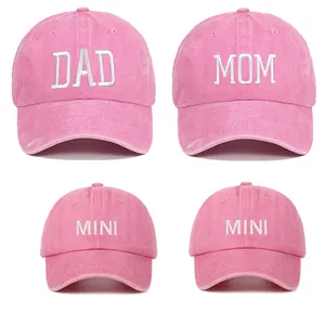 Set of four pink washed cotton parent-child baseball caps with white Dad Mom Mini embroidery