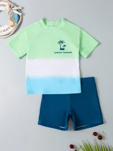 Boys' two-piece quick-dry swimwear set with green-blue gradient and palm print
