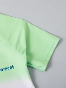 Detail macro view of boys' gradient swimwear sleeve with durable double stitching