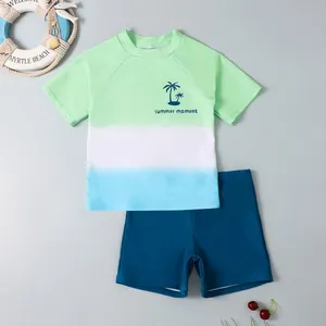 Kids two-piece quick-dry swimwear set featuring gradient green blue shirt and blue shorts