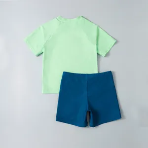 Quick-dry two-piece boys swimwear set with light green short sleeves and blue shorts