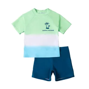 Professional boys two-piece gradient swimwear set with short sleeves and navy blue shorts