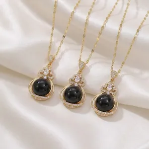 Elegant gold-plated titanium steel necklace with black round bead and zircon flower pendant