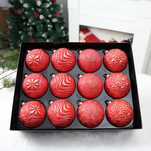 Detail of 12-pack 8cm red and gold painted Christmas ornaments in a black box.