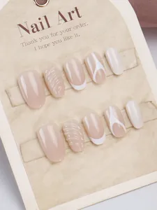 Detailed texture of nude pink and white French press-on nails with spiral ripples