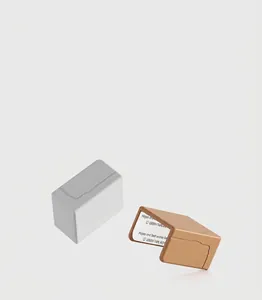 Close-up view of L-shaped silicone baby safety corner protectors in grey and brown colors.