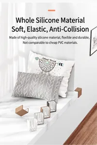 Detail of L-shaped silicone corner protectors on a window sill for child safety.