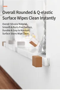 Detailed view of brown L-shaped silicone corner guard installed on a marble windowsill