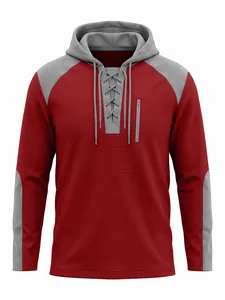 Détail du sweat à capuche gaufré rouge avec col lacé gris et poche zippée
