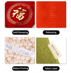 Details of gold foil, embossing, ribbon print, and fabric label on jewelry gift bags