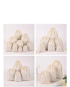 Multiple sizes of cream cotton drawstring pouches for jewelry and gift packaging.