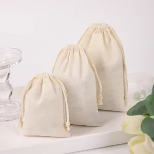 Set of three premium cream cotton drawstring bags for jewelry packaging and gift storage