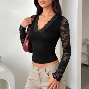 Elegant black V-neck long sleeve lace top featuring sheer floral patterns and slim fit design