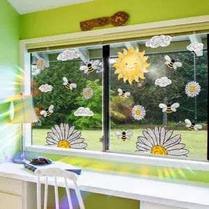 Rainbow sun and daisy prism window clings creating colorful light effects in a room.