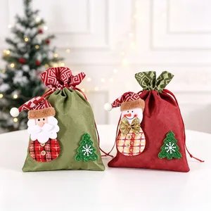 Two festive Christmas burlap drawstring gift bags featuring Santa and snowman figures.