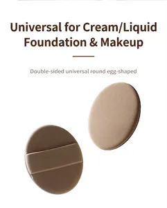 Macro view of double-sided egg-shaped beige powder puff for liquid and cream makeup