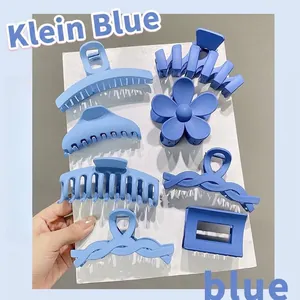 Detailed view of Klein blue matte hair claw clip set with various shapes