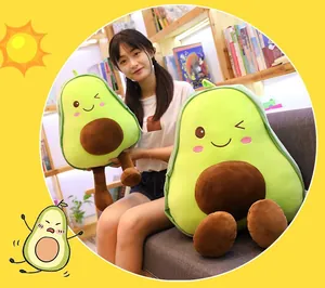 Cute avocado plush pillow toy held by a girl in a cozy and warm indoor room setting.