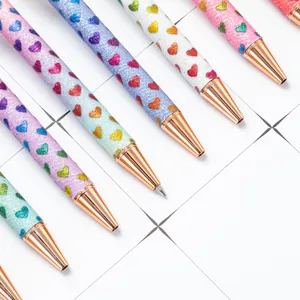 Colorful glitter ballpoint pens featuring heart patterns and elegant rose gold metal tips